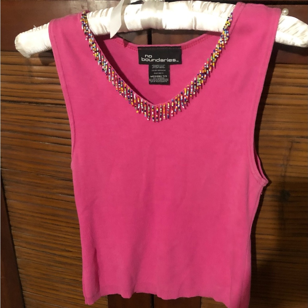 Cute knit top with beads.